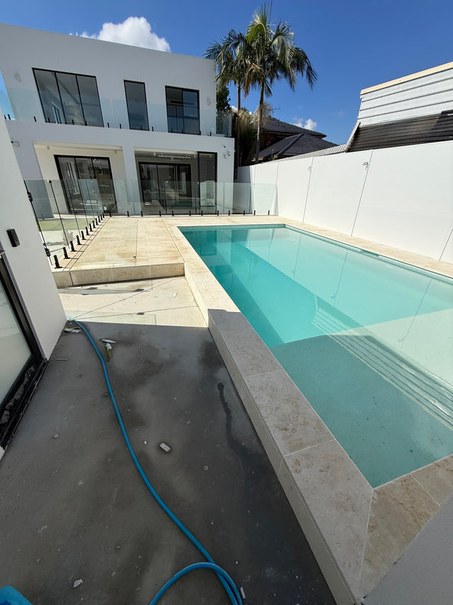 Pool edge and surrounding paving along the residence, Punchbowl.