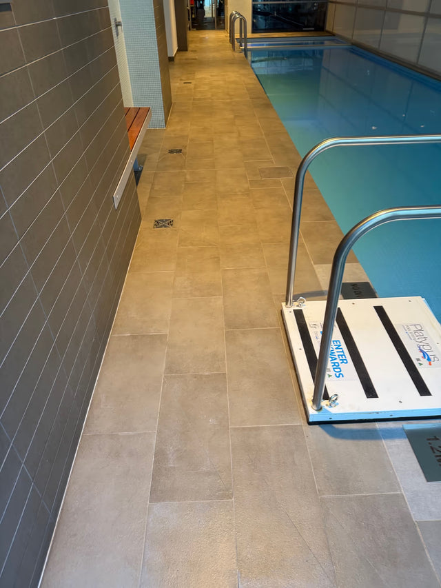 Indoor tiled pool deck after documented cleaning and sealing work in Milsons Point - After Job